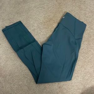 Grey/blue lululemon leggings with mesh design down the side (no pockets)